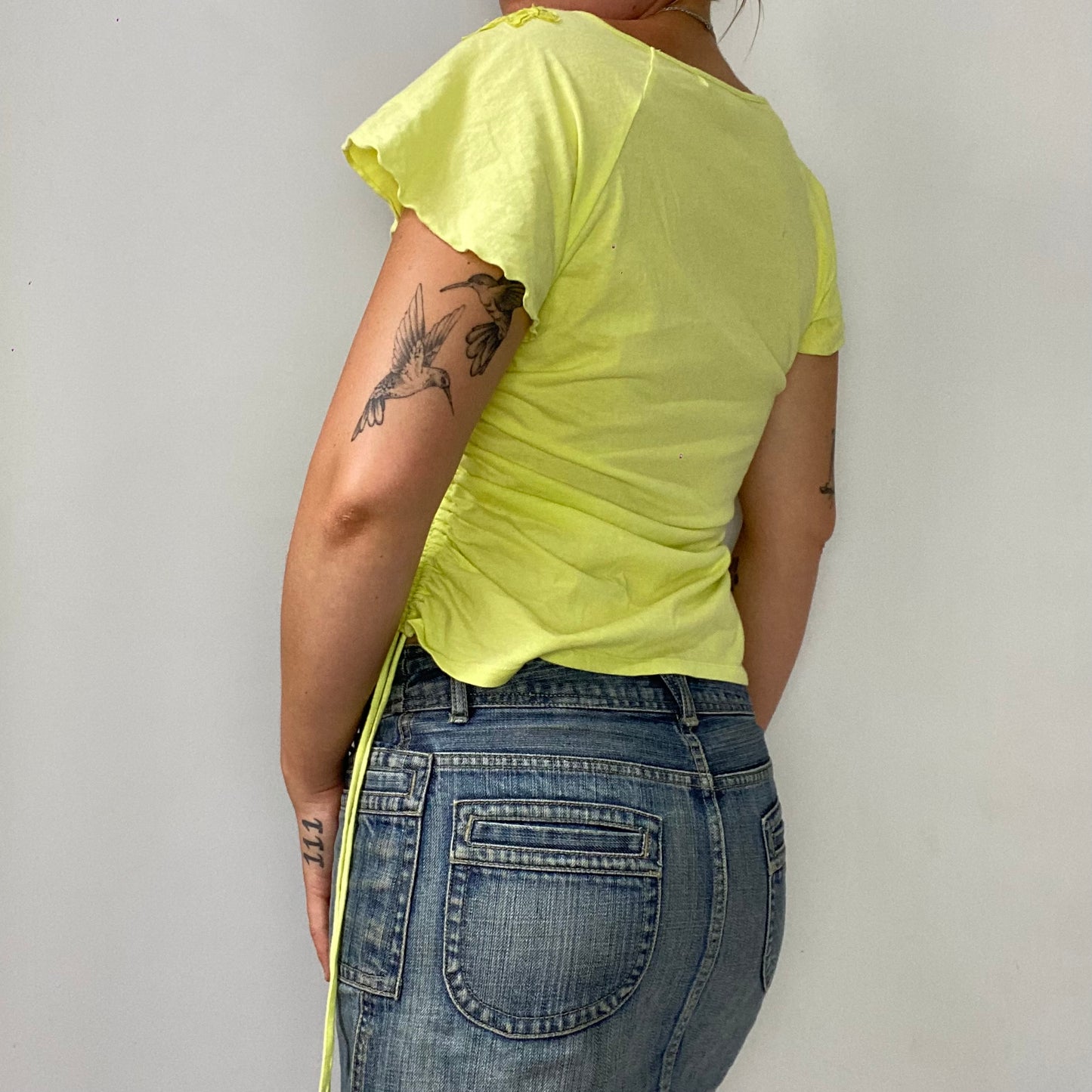 yellow ruched t-shirt with flower detailing