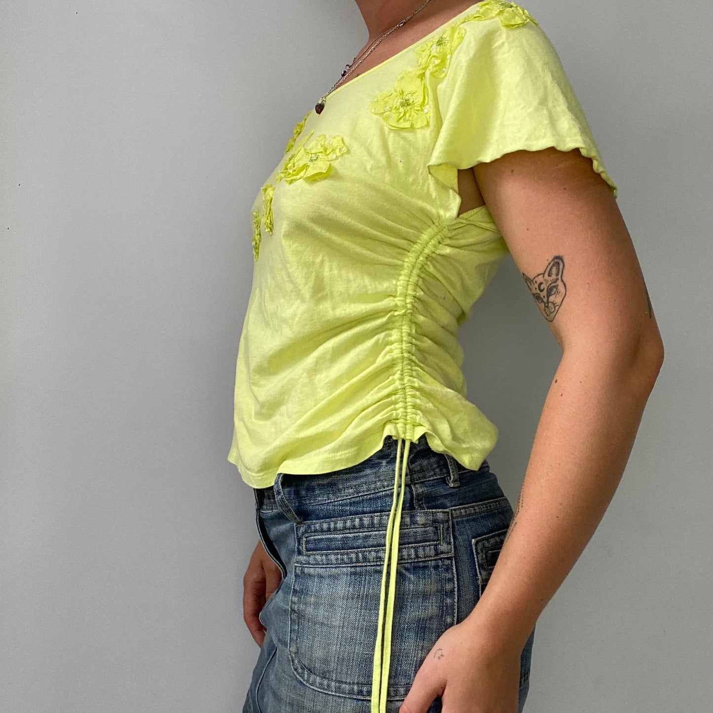 yellow ruched t-shirt with flower detailing